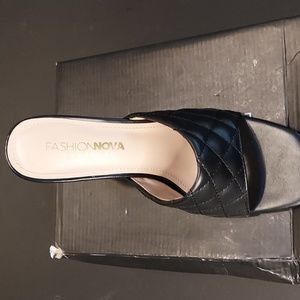 Very nice pair of black leather size 7 fashion Nova mules